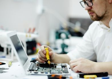 Laptop repair technician providing professional laptop service for JBR Dubai customers